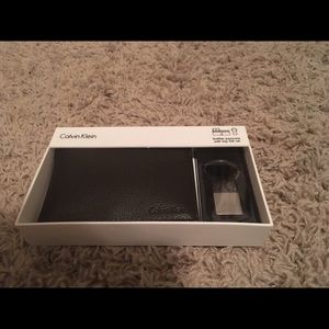 Used Calvin Klein passcase with key fob set
